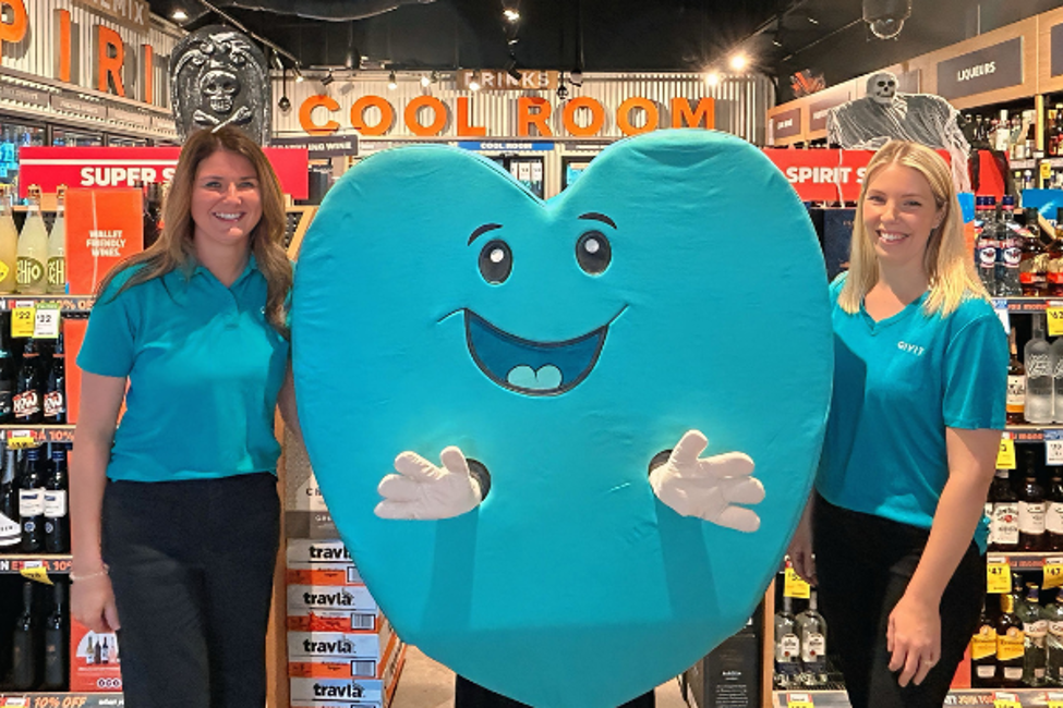2 GIVIT staff and the GIVIT heart in a BWS store