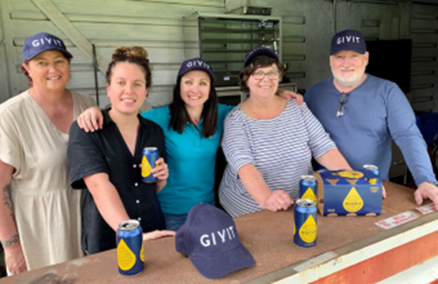 Volunteers standing in their new canteen at their local community soccer club