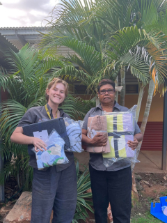 Staff from Nindilingarri with donated blankets.