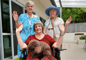 Staff and residents from Churches of Christ's Dianella Apartments with the donated wheelchair