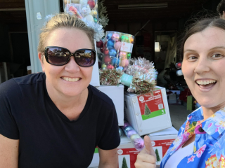 Volunteers and Lismore locals picking up Christmas decorations.