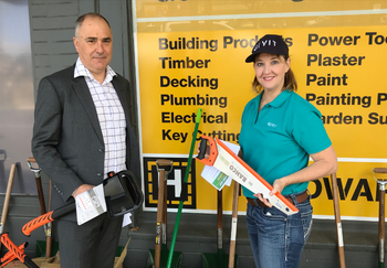 GIVIT Engagement Officer Lisa Herbert holding donated tools with Gippsland Lakes Complete Health's John Yiannacou